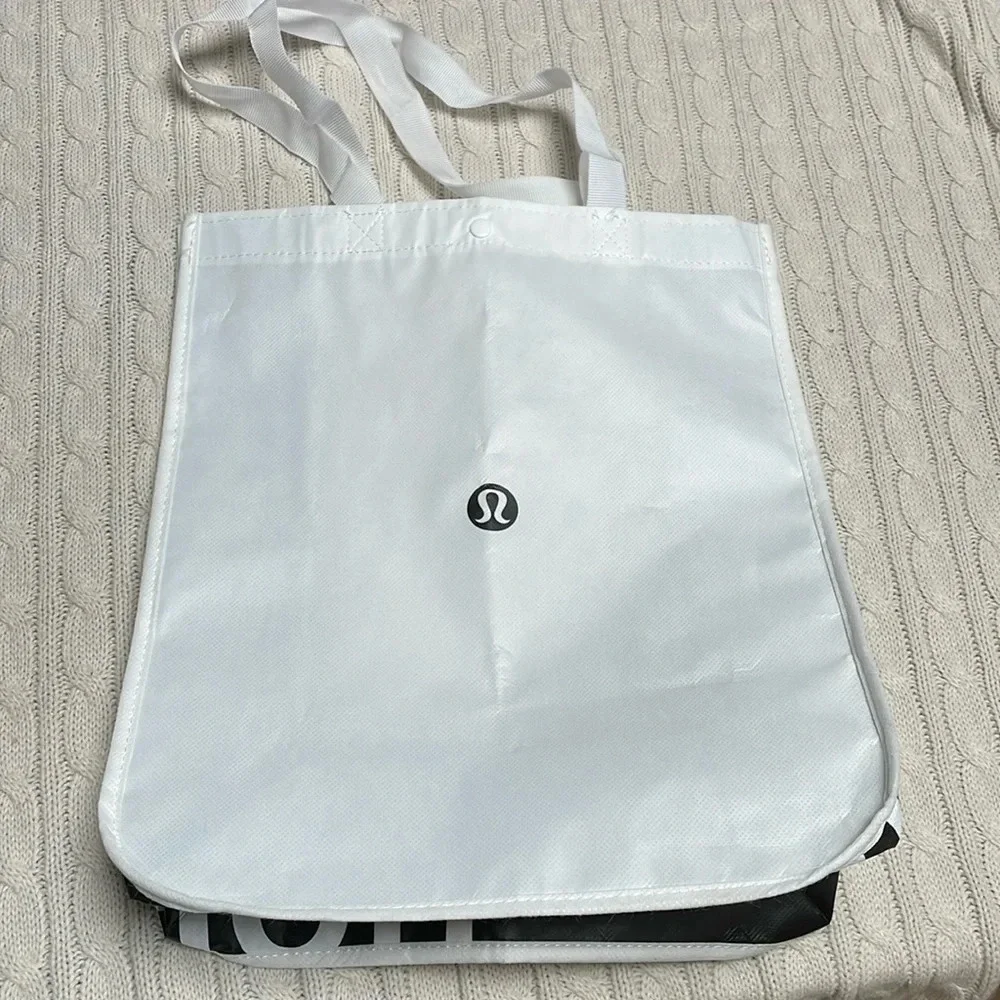 Lululemon reusable tote Snap closure. Black and white. 16” long x 14” wide x 6”